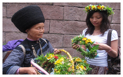 Miao women selling flowers in Fenghuang