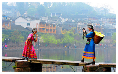 Wear Tujia or Miao costumes in Feanghuang 